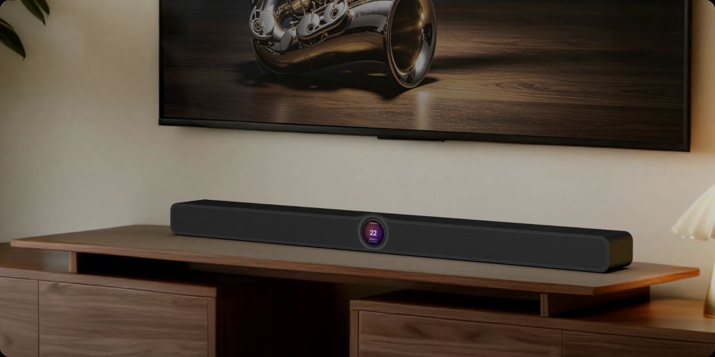 WiiM Bar placeret på et TV-møbel med et TV synligt ovenover.